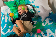 Load image into Gallery viewer, organic-cotton-quilt-cover-set-jammin-music-graffiti-speakers-green-single-display-boy lying-down-holding-balls