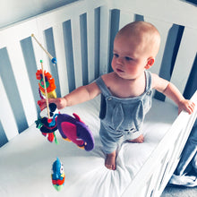 Load image into Gallery viewer, organic-natural-cotton-baby-White-jersey-fitted-sheet-baby-standing-display-cot